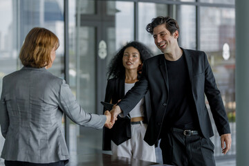 Businesspeople sitting handshake during meeting signing agreement success. professional cooperation partner connection support. executive shake hands and reach an agreement.
