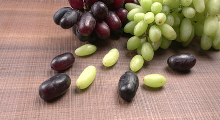 Natural organic different types of fresh ripe juicy grapes and space for text on table. top view, Agriculture concepts.