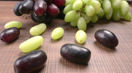 Natural organic different types of fresh ripe juicy grapes and space for text on table. top view, Agriculture concepts.