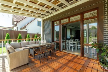 Serene Outdoor Patio with Comfortable Seating and Greenery