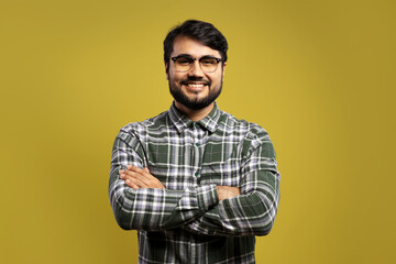 man with glasses with arms crossed