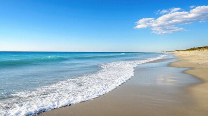 Clear European sea waves gently crashing on the beach, with empty space in the sky for text. No people around.