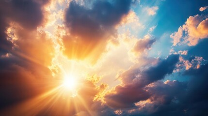 Fototapeta premium Dramatic sunset sky with golden rays and clouds