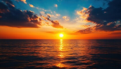 Fototapeta premium Dramatic Sunset over the Ocean with Clouds and Reflections