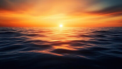 Fototapeta premium A stunning sunset over the ocean with golden hues reflecting on the calm waves. The vibrant sky creates a beautiful seascape that is perfect for travel vacation or nature themed projects