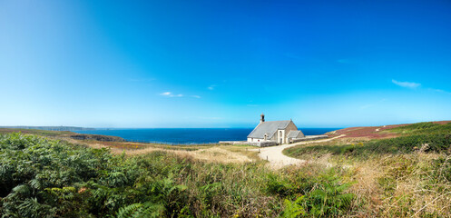 Panoramic landscape view from the Pointe du Van to the Pointe du Raz in Brittany in France, in the foreground the chapel Saint-They