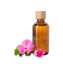 Geranium essential oil in bottle and beautiful flowers isolated on white