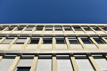 Facade of modern building against blue sky