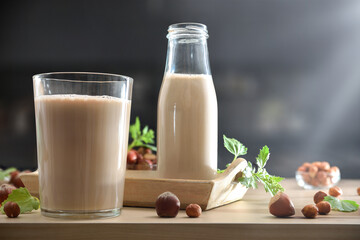 Hazelnut drink on kitchen bench and dark kitchen in background