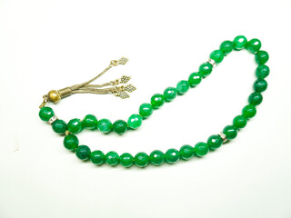 Green agate stone prayer beads tasbeeh isolated on white background 
