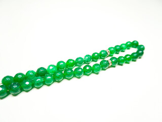 Green agate stone prayer beads tasbeeh isolated on white background 