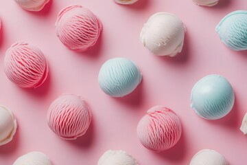 Various scoops of ice cream in shades of pink, blue, and white are artfully arranged against a soft pink surface, creating an abstract and minimalist display.