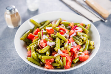 green bean salad with tomato and onion, up high
