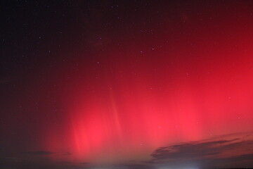 Bright red northern lights (aurora borealis) in the night