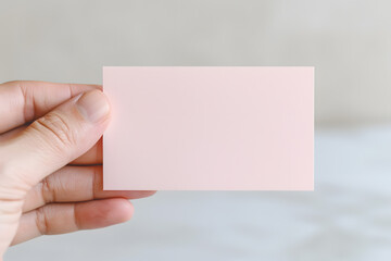 Hand Holding a Sheet of Sticky Note | Essential Tool for Organisation and Reminders in Everyday Life
