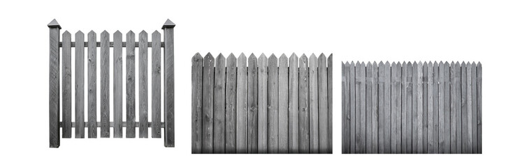 Fototapeta premium A black and white photograph of a wooden fence with pointed tops.