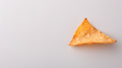 Single Nacho Chip on a Flat White Background | Perfect for Snack and Culinary Concepts