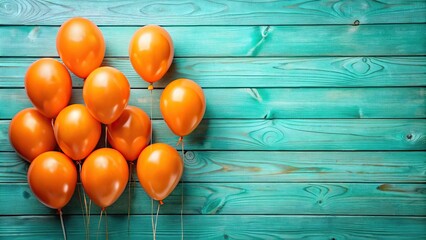 Obraz premium orange balloons with teal wooden background