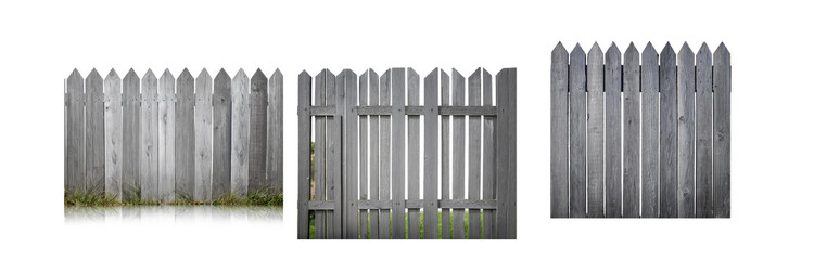Fototapeta premium A close-up view of three sections of a wooden fence with pointed top rails, each with a slightly different style.
