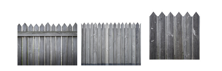 Fototapeta premium Gray wooden fence with pointed tops, viewed from the side.