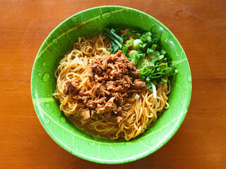 Delicious Chicken Noodles with Fresh Scallions and Savory Garnish