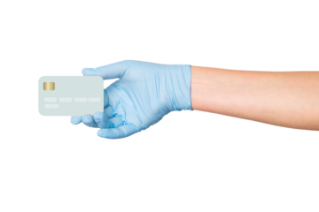 Hand in medical gloves holding a credit card on an empty background. Online payments, medical billing, healthcare transactions.
