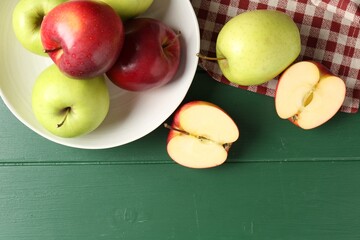Fresh ripe apples on green wooden table, flat lay