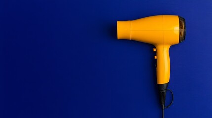 Yellow hairdryer on a blue background.
