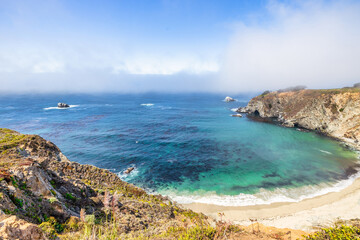 Beautiful landscape of Pacific Ocean coast along Highway 1 and Big Sur, aerial view, sunset, sunrise, fog. Concept, travel, vacation, weekend