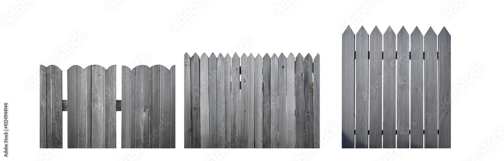 Poster a gray wooden fence with pointed tops. the fence is made of vertical slats of wood with some having 