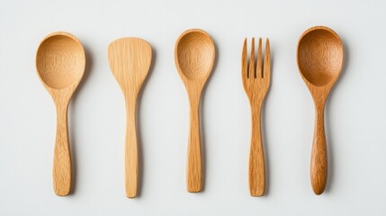 Five wooden kitchen utensils on a white background, including two spoons, a spatula, a fork, and a ladle.