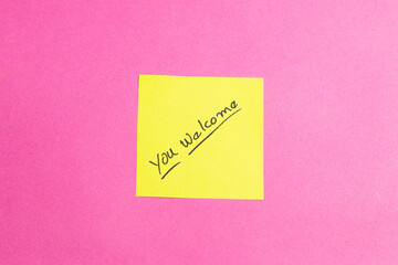 A yellow sticky note with the words 