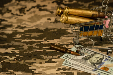 American dollars, cartridge and cartridges on a green, military background