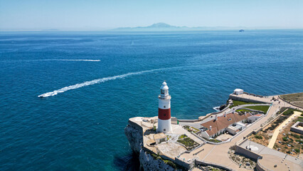 Aerial view of the lighthouse, boat, and the Africa continent in a background, Gibraltar