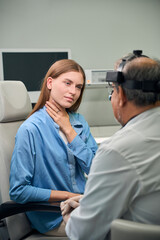 Female caucasian patient listens to doctor's instructions