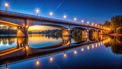 Naklejka premium Bridge over river reflected in the water at night and morning