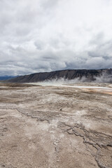 Barren Scenic Landscape of Yellowstone National Park in Wyoming Featuring Dramatic Clouds and Terrain
