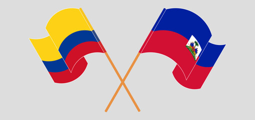 Crossed and waving flags of Colombia and Republic of Haiti. Vector illustration