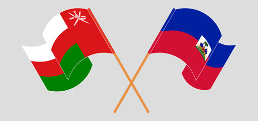 Crossed and waving flags of Oman and Republic of Haiti. Vector illustration