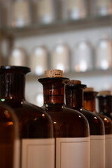 a dark brown glasses bottles with perfume