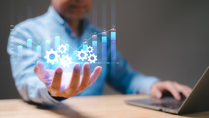 Business professional explores data analytics with visual graphs and gears, symbolizing innovation, efficiency represents modern strategies for improving organizational performance, decision-making