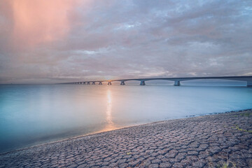 Rising sun above by the Zeeland Bridge, Zierikzee The Netherlands.