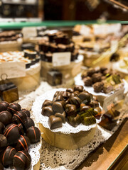 Shelves with candies and chocolates in a craft sweet shop. Sweets and chocolate concept