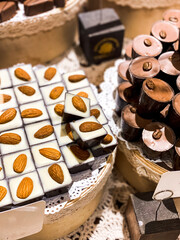 Shelves with candies and chocolates in a craft sweet shop. Sweets and chocolate concept