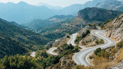 Fototapeta premium Winding Road Through a Mountainous Landscape