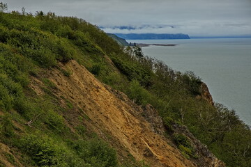 Shores of the Sea of ​​Okhotsk on a cloudy summer day