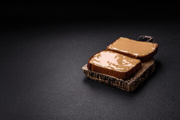 Sandwiches with toast bread, peanut butter and raspberry or strawberry jam