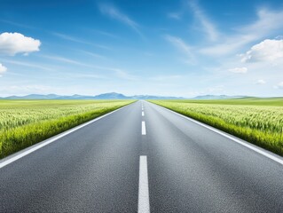 Fototapeta premium A tranquil road stretches into the distance, flanked by lush greenery under a bright blue sky, perfect for travel and adventure.