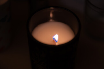 Candle flame in a dark room