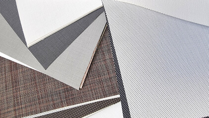 interior design plastic drapery samples swaps of color in grey and brown shades for selection....